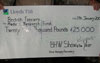 The cheque for &pound;25k from the British Homing World Show of the Year
