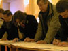 Pigeon Fanciers completing the questionnaires at the show